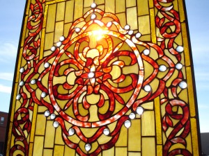 A crimson golden stained glass window. 