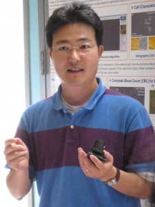 Scientist holding LUCAS cell phone
