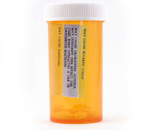 Side effects written on a medicine bottle